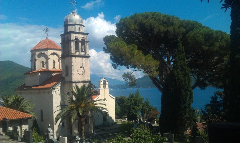 Savina Monastery with bell tower, domes and cypress trees overlooking the Bay of Kotor
